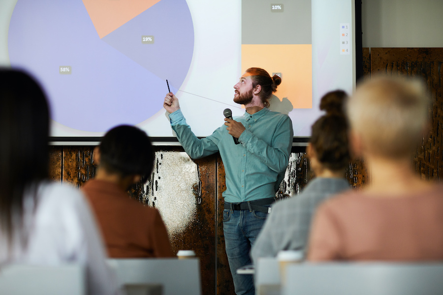 Man giving Dissertation Presentation