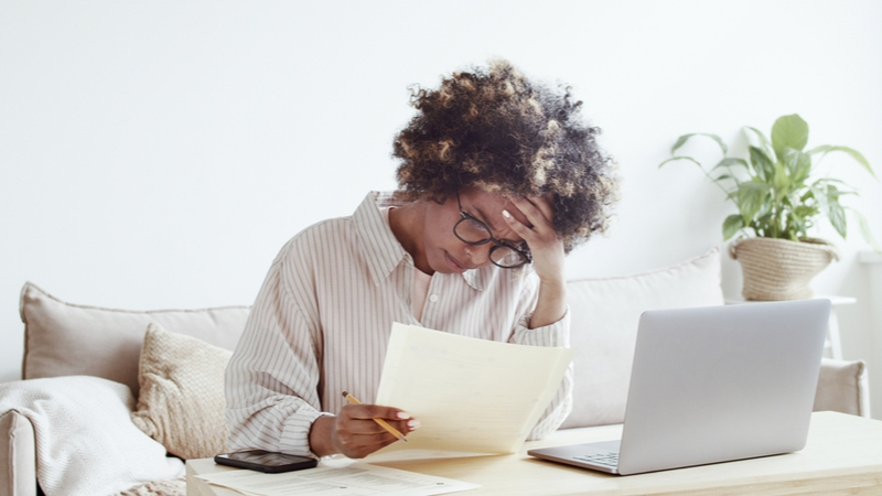 african american woman struggling with her studying at home